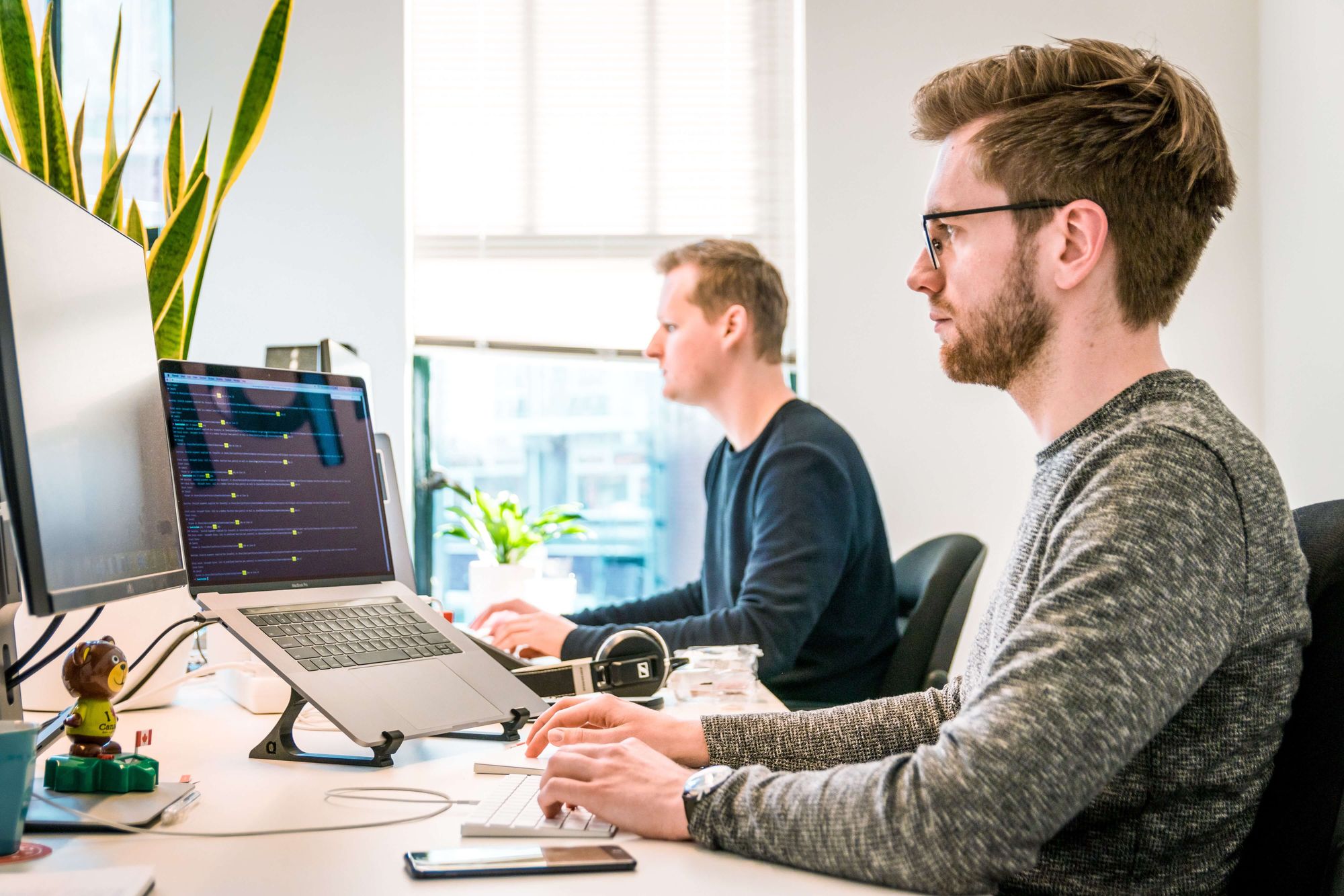 software developer working on a project while sitting at a desk