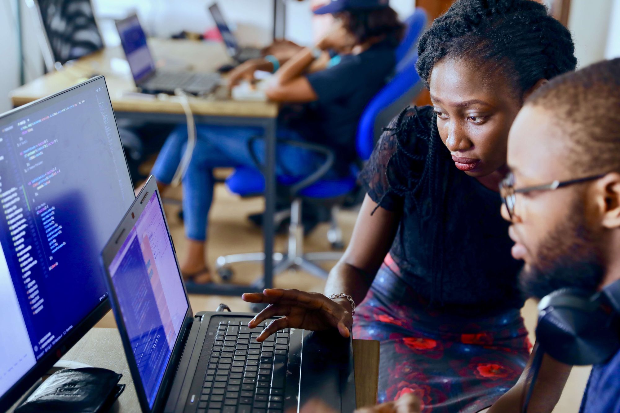 developer marketing, two developers looking at code on a screen